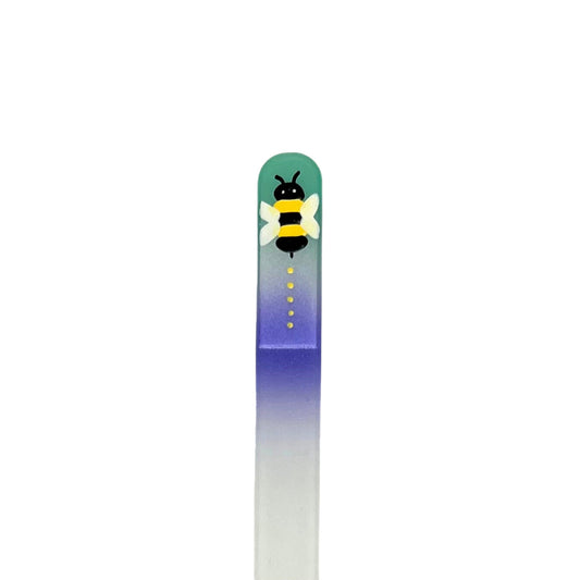 glass nail file with yellow and black bee design in teal and purple